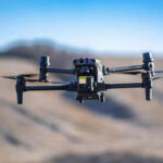 Misfire in the Sky As Laser Hits US Border Drone Drone flying in a clear blue sky