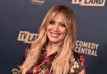 Mom Group SCANDAL Fuels Duff Controversy A smiling woman in a floral dress at a TV Land event