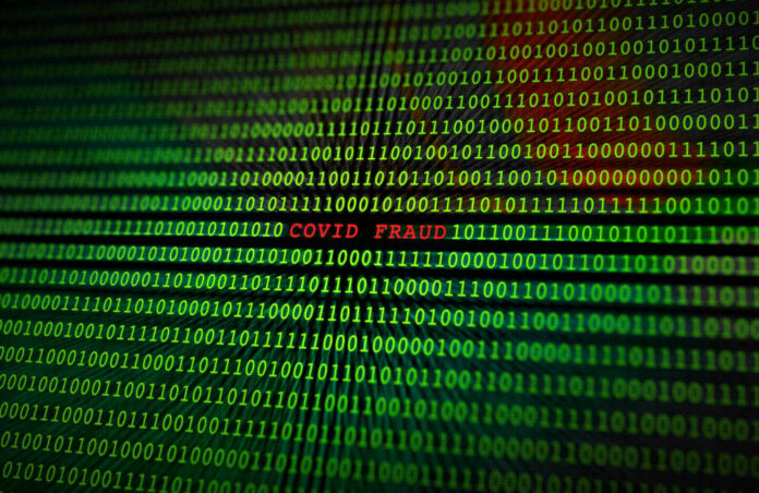 Covid-19,Fraud,Scam,On,A,Binary,Monitor,Screen