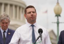 FBI’s Unprecedented Move: Swalwell Files to Surface? A politician speaking at a press conference outside the Capitol building