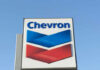 Chevron logo sign against blue sky