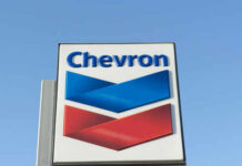 Chevron’s LNG Nightmare: War, Weather, and Chaos Chevron logo sign against blue sky