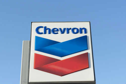 Chevron logo sign against blue sky