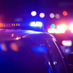 Terrorist Attack THWARTED in Austin’s Nightlife Hub Police car lights flashing in the dark night