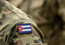 Close-up of a soldier's uniform featuring the Cuban flag patch