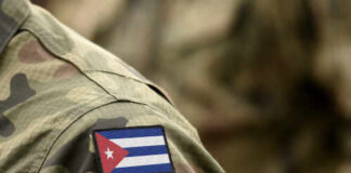 Close-up of a soldier's uniform featuring the Cuban flag patch