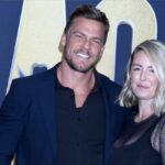 Hollywood Brawl: ‘Reacher’ Star Fights Neighbor A smiling couple posing together at a red carpet event