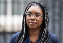 North Sea Oil: Taxpayer Relief or Financial Trap? Close-up portrait of a woman with braided hair wearing glasses