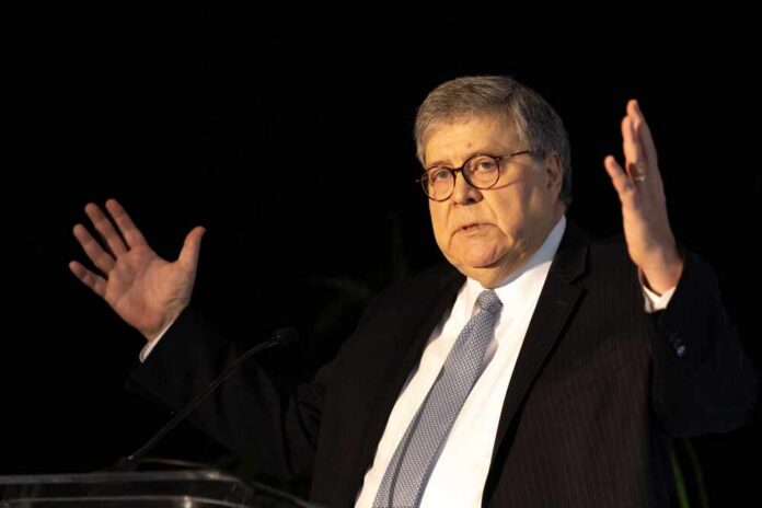 A man in a suit gesturing while speaking at a podium