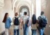 Youth’s “Socialism” Confusion – What’s Behind It? Group of students walking through a university corridor