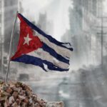 Trump’s Cuba Threat: National Security or Overreach? Worn Cuban flag standing on rubble in a desolate urban environment