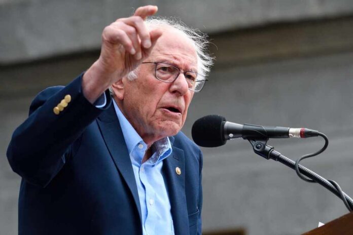 A man passionately speaking at a microphone during a public rally