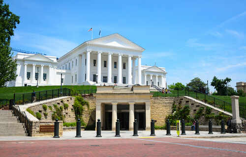 shutterstock_318871499.jpg Historic government building with white columns and green lawn