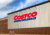 Costco’s Price Spikes: How Tariffs Hit Home Costco Wholesale store exterior with logo.