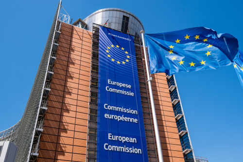 Exterior view of the European Commission building with EU flags