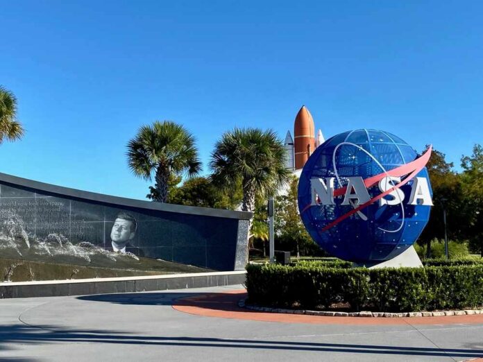 NASA logo and memorial wall featuring John F. Kennedy