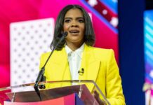 Trump’s Explosive Rant Targets MAGA Stars A woman in a yellow blazer speaking at a podium with a microphone