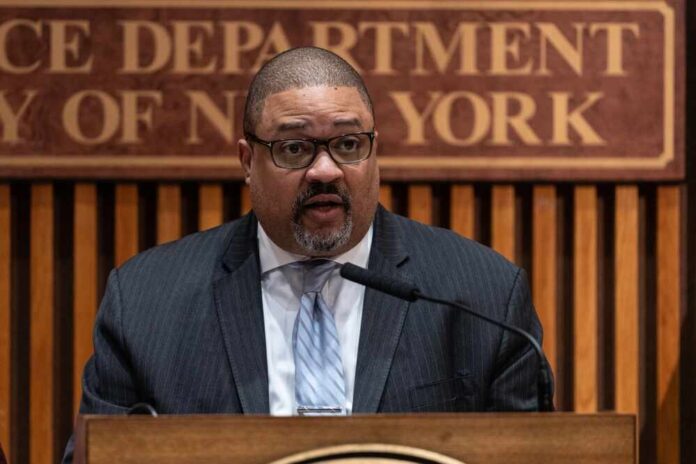 A man speaking at a podium during a press conference