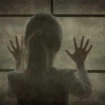 Federal Custody NIGHTMARE: Child’s Abuse Claims A silhouette of a child with hands pressed against a window
