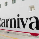 Close-up of the Carnival cruise ship logo on its hull