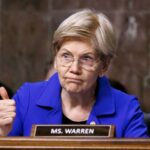 A senator giving a thumbs up during a hearing