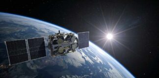 Satellite orbiting Earth with solar panels and the sun in the background