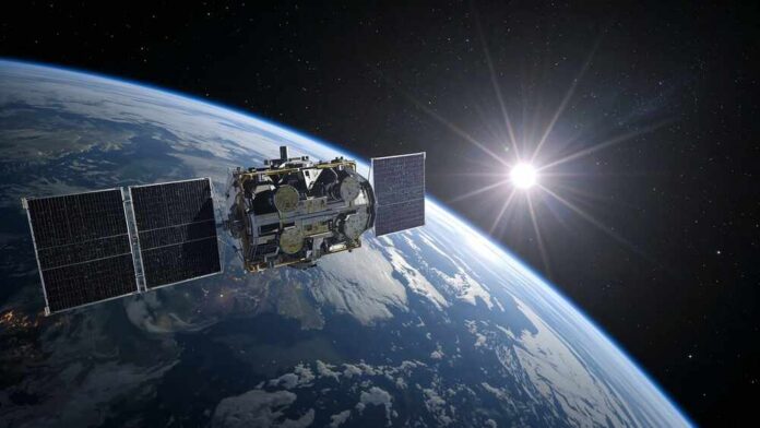 Satellite orbiting Earth with solar panels and the sun in the background