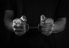 Trainee’s Disturbing Harassment Campaign Revealed Hands holding handcuffs in a black and white image