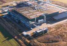Data Centers INVADE—Who Picks Up the Tab? Aerial view of a large industrial facility with various structures and equipment
