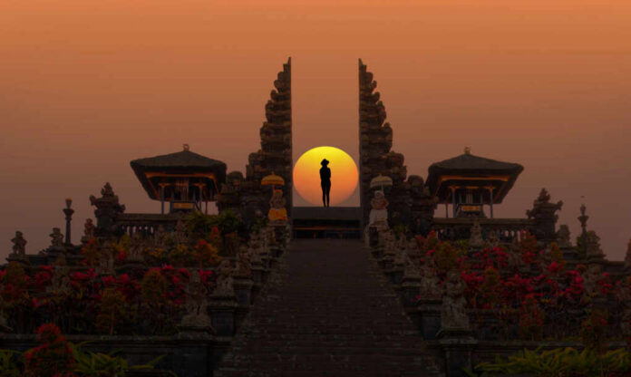 Pura-Besakih-temple-on-the-slopes_2502888447 Silhouette between ancient temple gates at sunset.