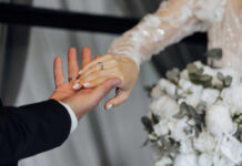 North Carolina’s ‘Homewrecker’ Law Strikes Hard Hands of a couple wearing wedding bands