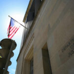 Department of Justice building with American flag