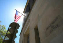 Department of Justice building with American flag