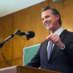 Man speaking at podium with microphone