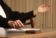 Parental Rights UPROAR: Kansas Judge Blocks Ban! Judge's hand striking a wooden gavel on a block
