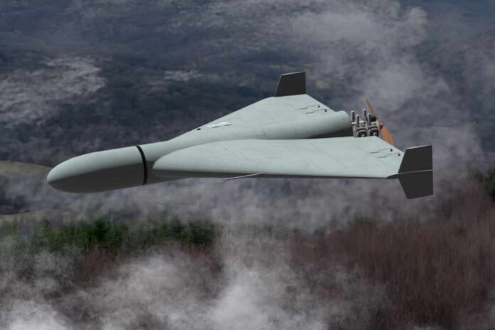 Flying wing drone with pusher propeller over foggy forest