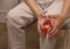The Price of Inches: Surgery Gone Wrong Person holding knee with highlighted joint pain illustration