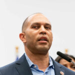 A government official speaking at a press conference
