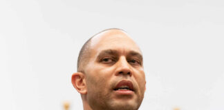 A government official speaking at a press conference