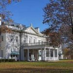 Epstein Connection Rocks Bard Leadership A historic white mansion surrounded by autumn trees and a clear blue sky