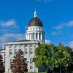 State capitol building with a dome under a clear blue sky
