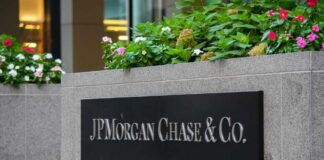Sign for JP Morgan Chase & Co. with flowers in the foreground