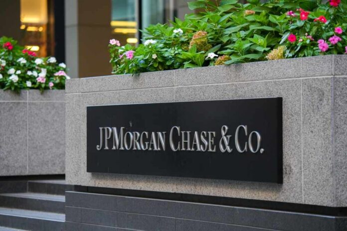 Sign for JP Morgan Chase & Co. with flowers in the foreground