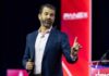 Amazon’s Secret ‘Apprentice’ Plot: Trump Jr. In? A man speaking at a conference with a microphone in hand