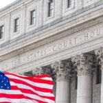 Violent Threats Erupt After Supreme Court Leaks Facade of a United States courthouse with an American flag in the foreground