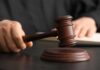 Trump’s Emergency Powers BLOCKED by State Judge A judge's hand holding a gavel above a wooden block