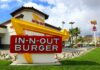 In-N-Out Nightmare: Armed Suspect Still Loose! In-N-Out Burger restaurant sign with a bright yellow arrow