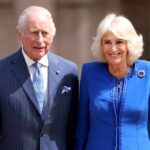A royal couple smiling during a public appearance
