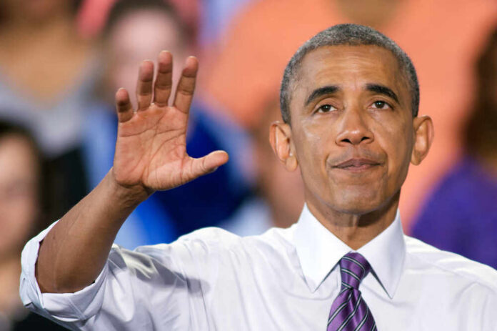 shutterstock_718840300.jpg A speaker gesturing with one hand while addressing an audience