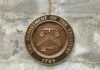 Department of the Treasury bronze seal on stone wall